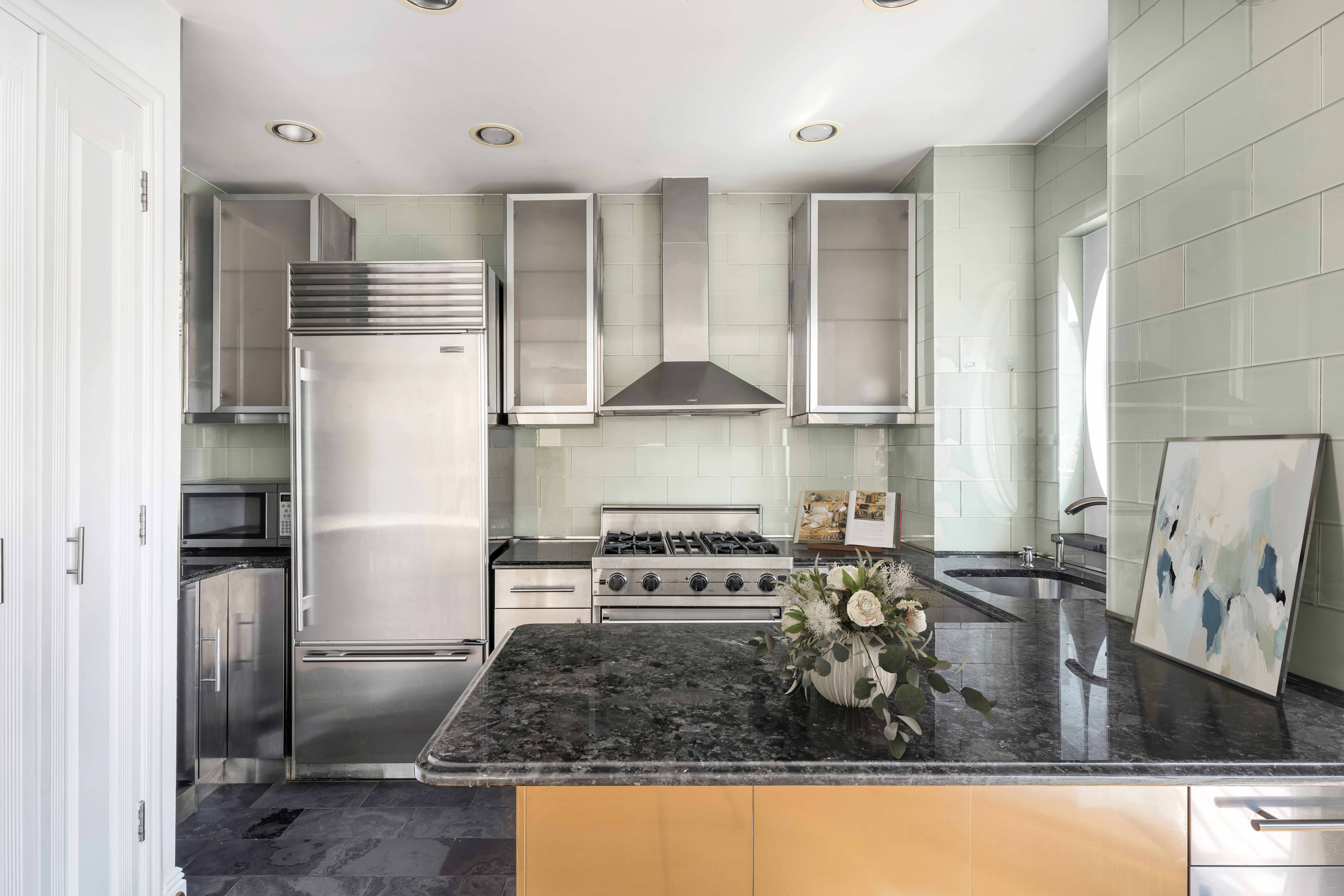 189 Bridge Street, Unit 3A Brooklyn, NY 11201 - Photo 5 of 19 a kitchen with stainless steel appliances granite countertop a refrigerator a stove and a sink