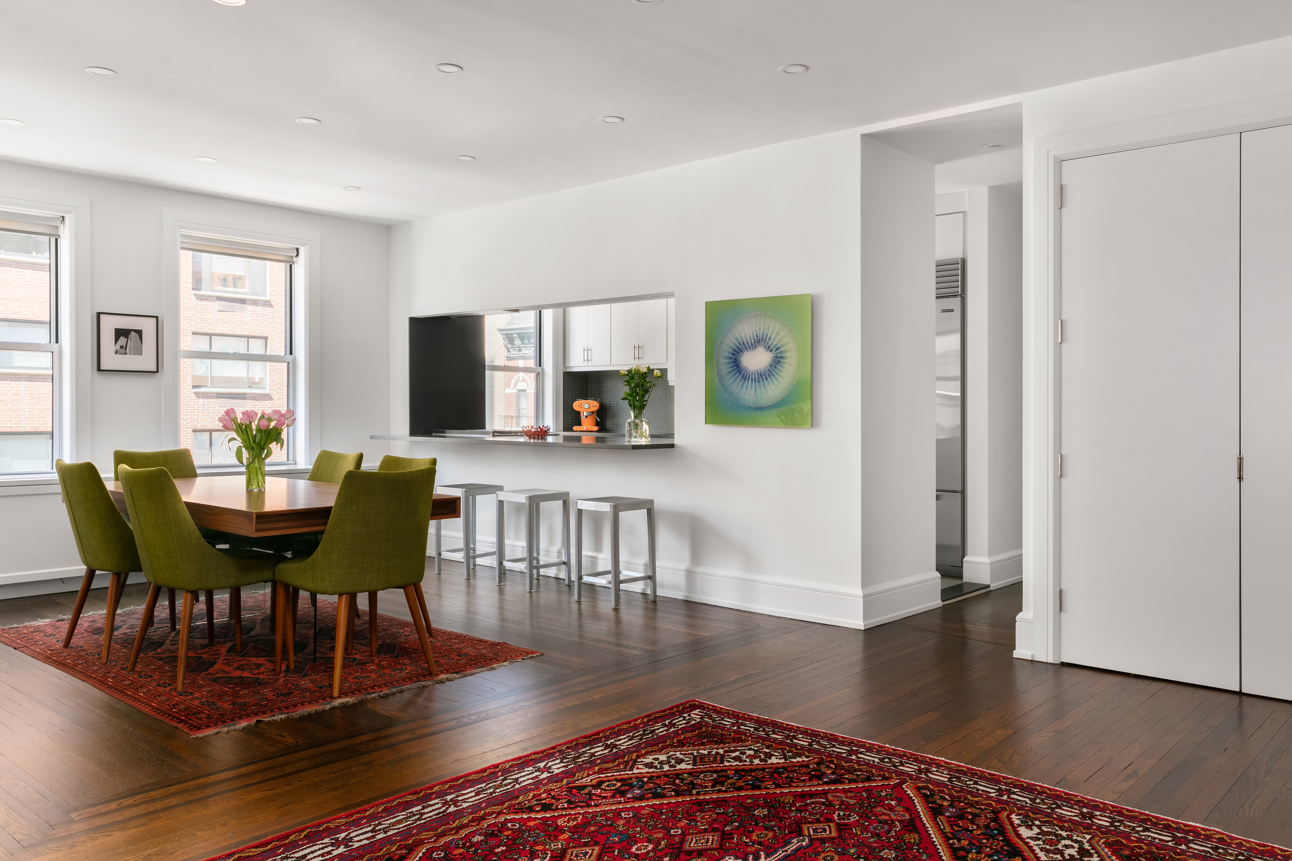 a view of a dining room with furniture and wooden floor