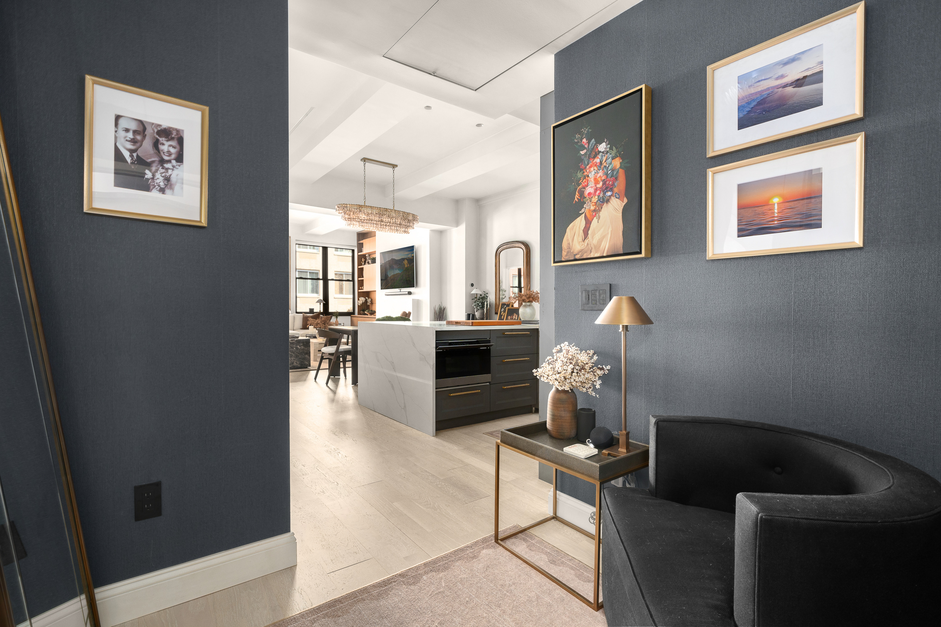 521 West 47th Street, Unit 3B Manhattan, NY 10036 - Photo 2 of 15 a living room with furniture and a fireplace
