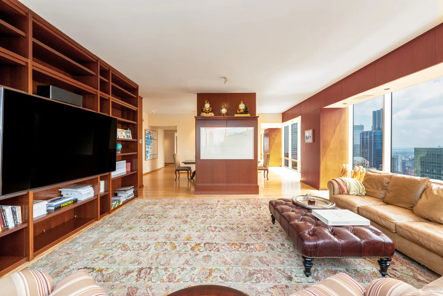 a spacious bathroom with a mirror a shower and vanity