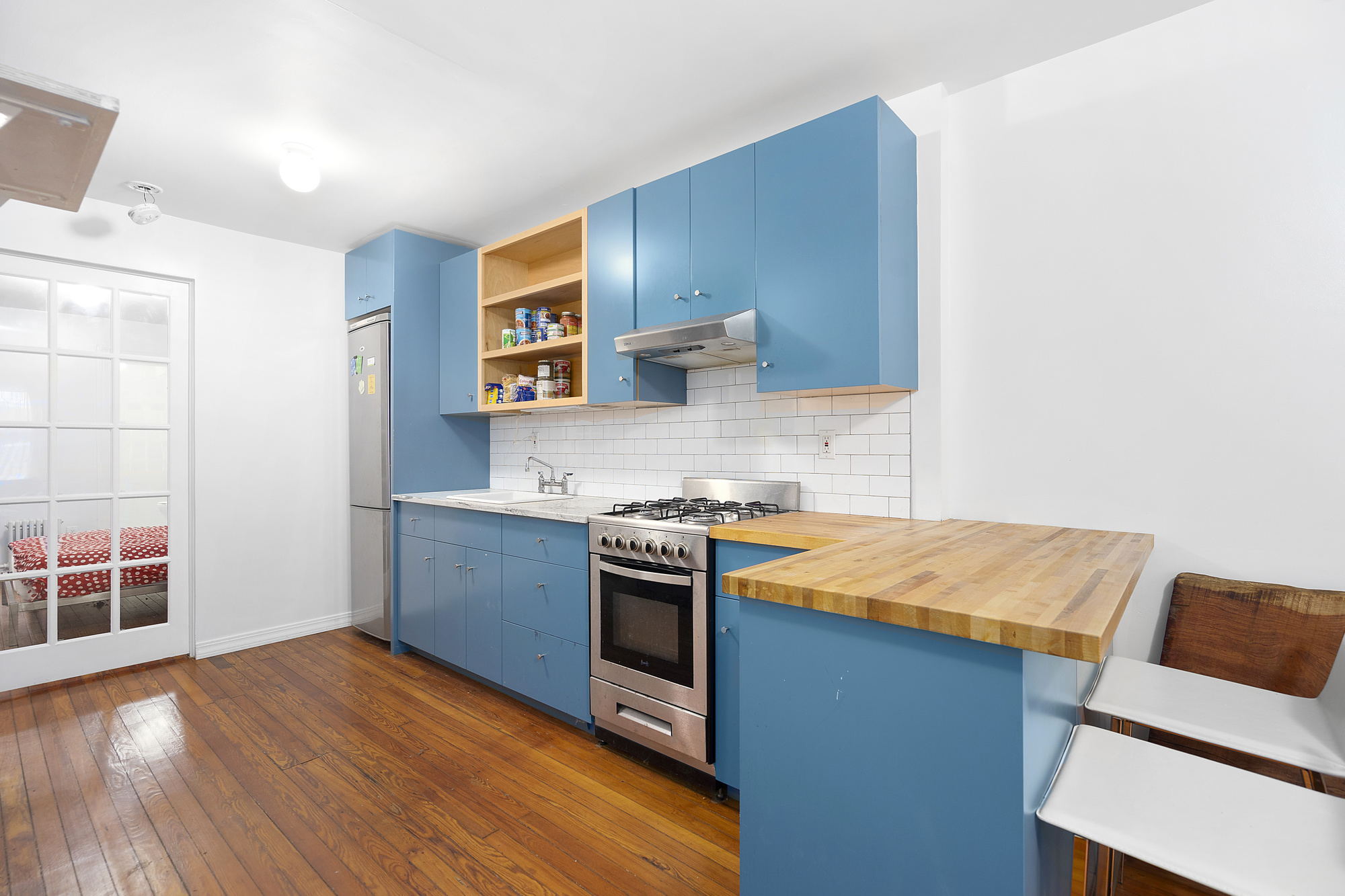 394 Lafayette Avenue, Unit 1 Brooklyn, NY 11238 - Photo 2 of 4 a kitchen with a stove and a microwave