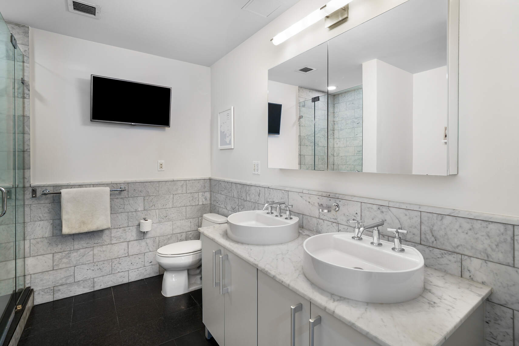 199 State Street, Unit 5C Brooklyn, NY 11201 - Photo 8 of 16 a bathroom with a toilet sink and mirror