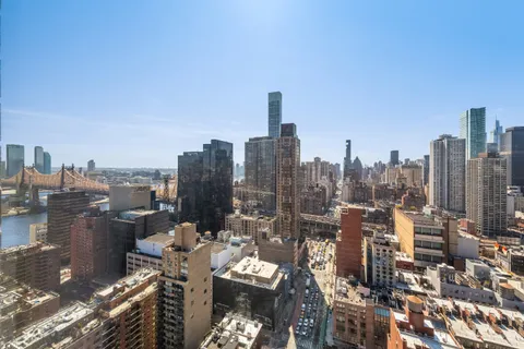 a view of a city with tall buildings