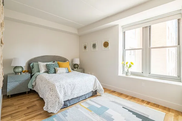 310 Clarkson Avenue, Unit 511 Brooklyn, NY 11226 - Photo 3 of 12 a bedroom with a bed and a window