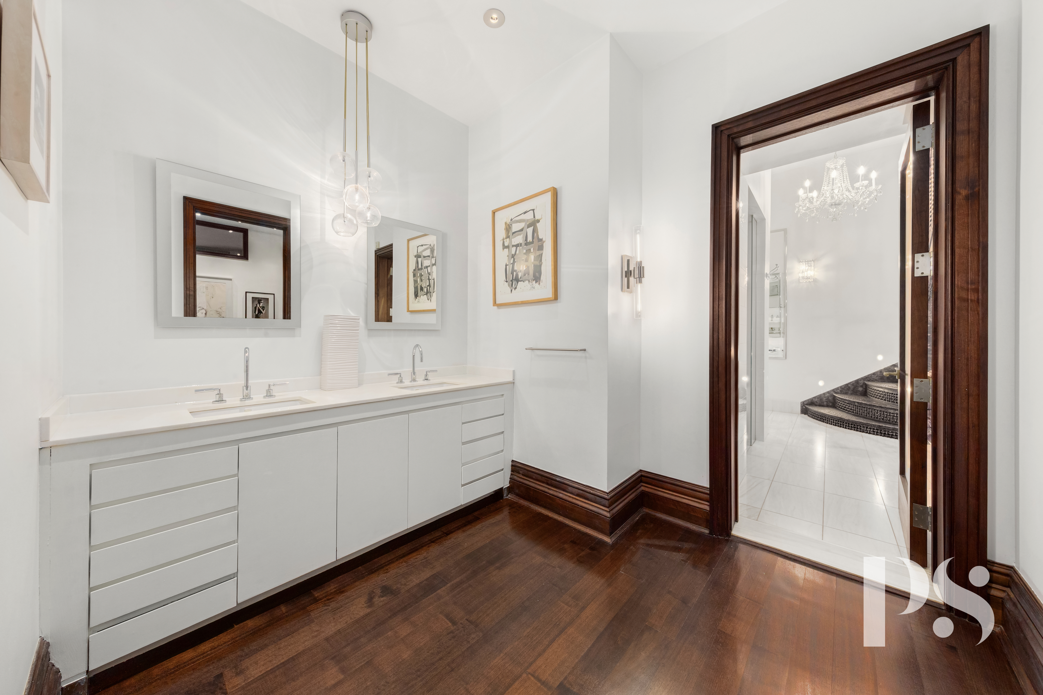644 Broadway, Unit 2E Manhattan, NY 10012 - Photo 10 of 18 a hallway with a large mirror and a dresser