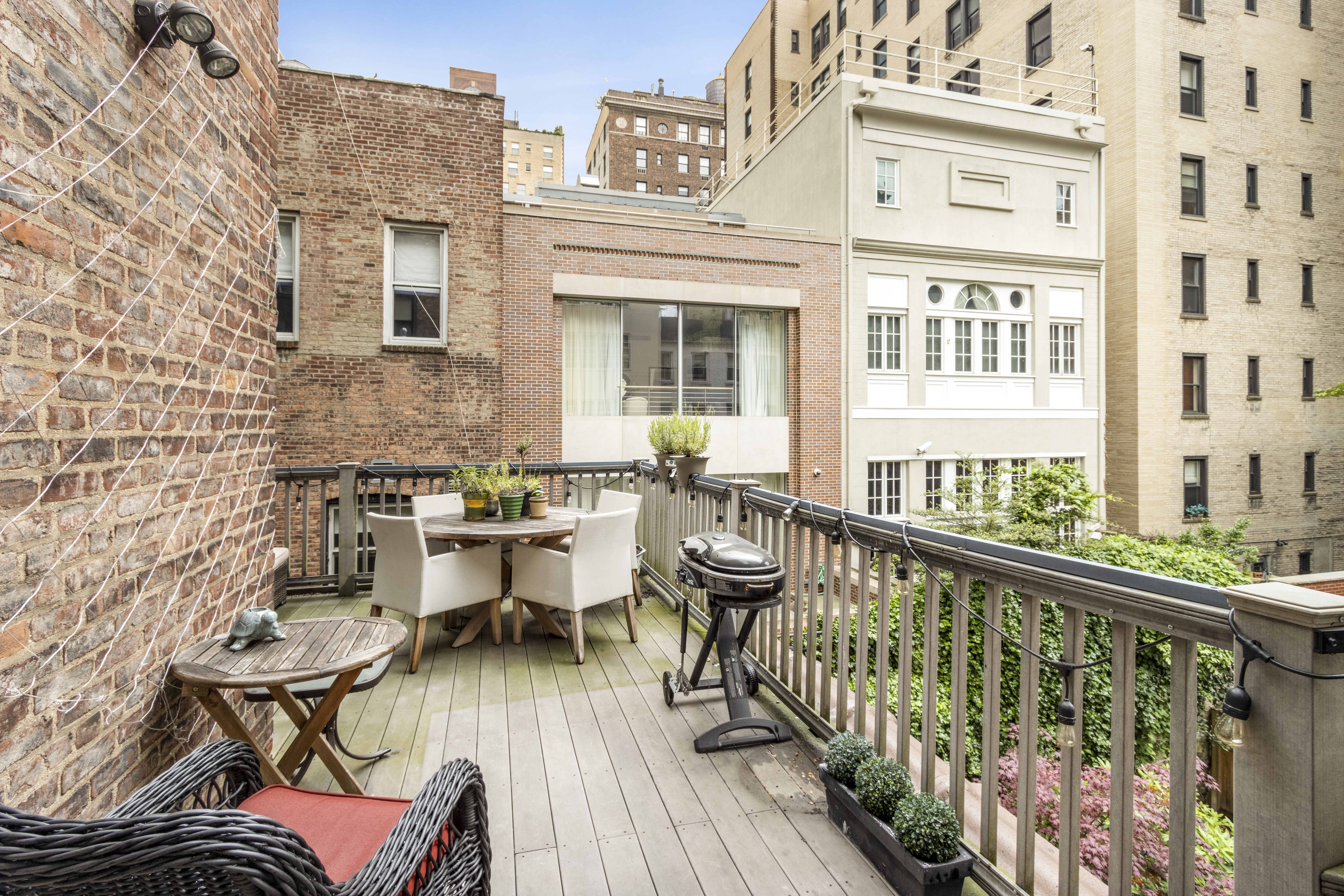 160 East 74th Street, Unit 3 Manhattan, NY 10021 - Photo 9 of 12 a balcony with table and chairs