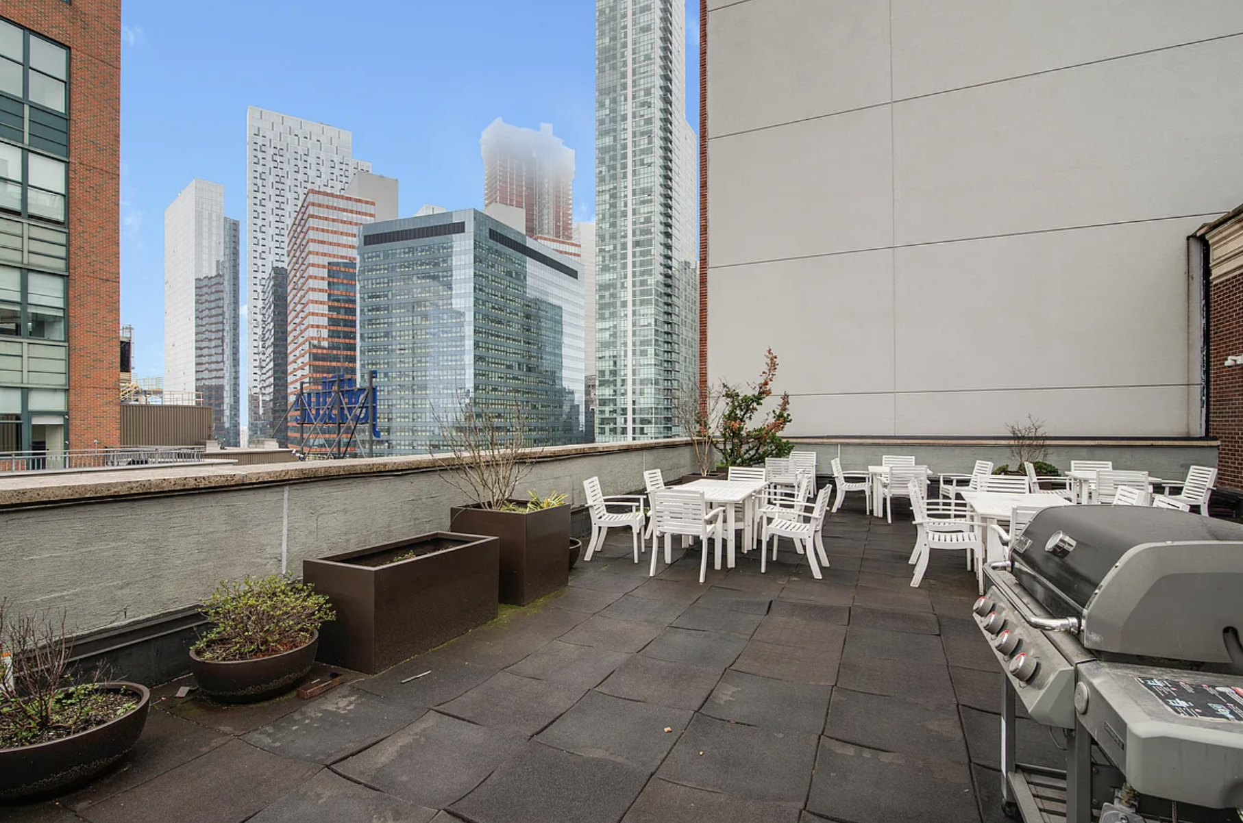 41-26 27th Street, Unit 4B Queens, NY 11101 - Photo 6 of 10 view of a patio with table and chairs