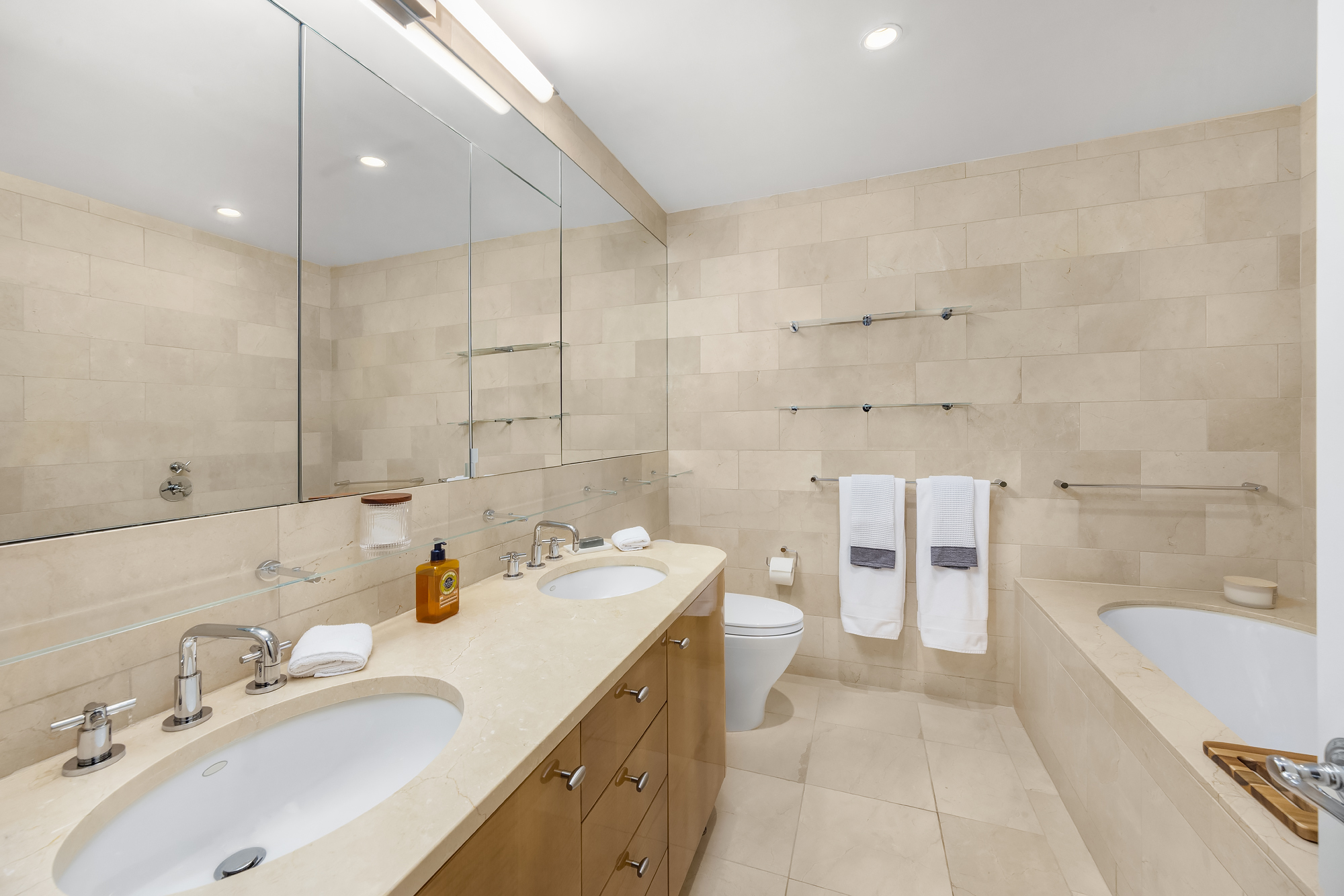 110 Central Park South, Unit 12ABC Manhattan, NY 10019 - Photo 39 of 49 a bathroom with a sink double vanity and a bathtub