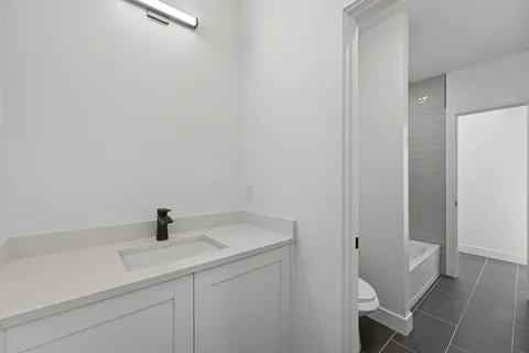 a bathroom with a bathtub and shower