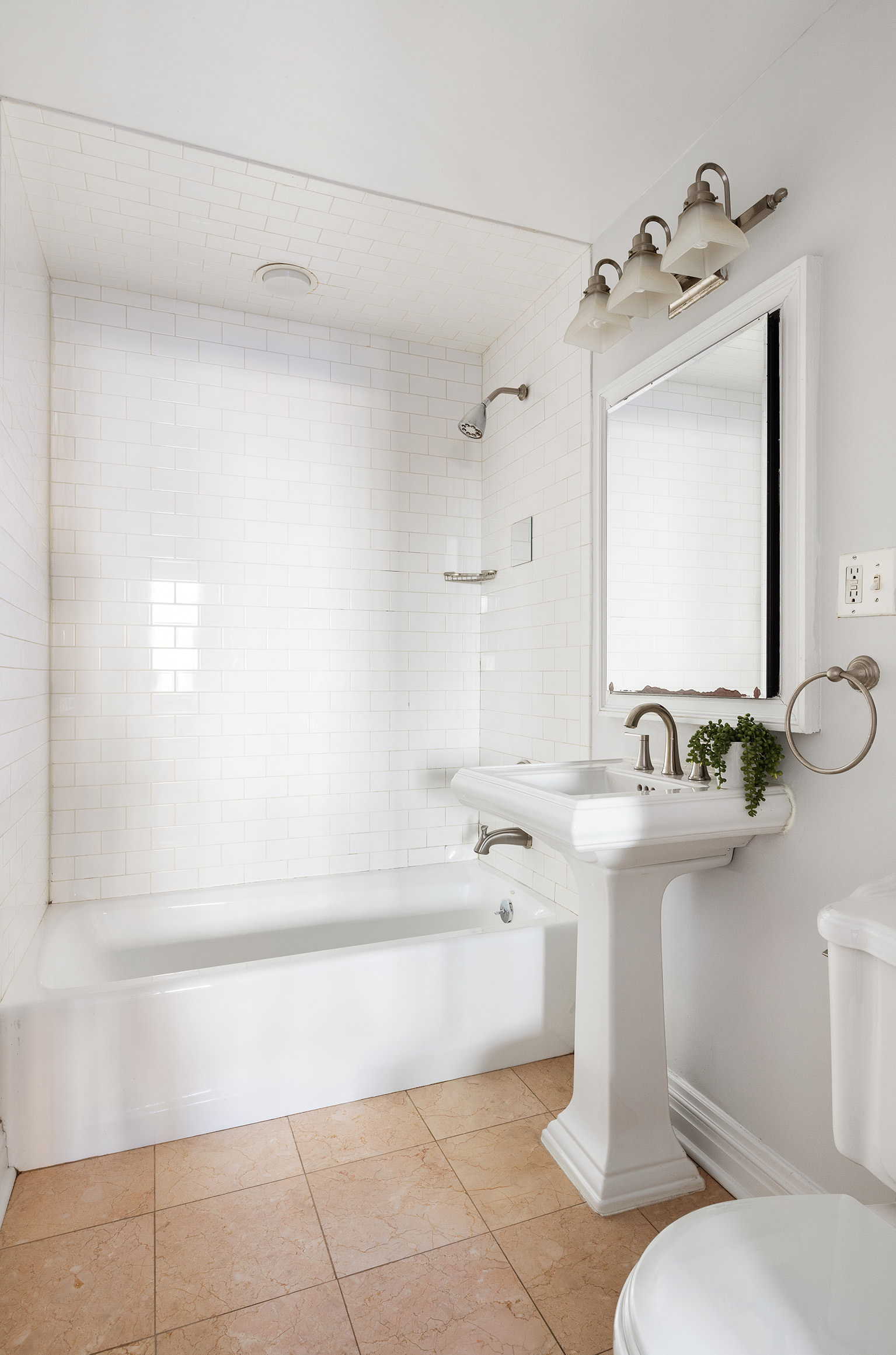 301 Warren Street, Unit 2 Brooklyn, NY 11201 - Photo 8 of 11 a bathroom with a sink a toilet and mirror
