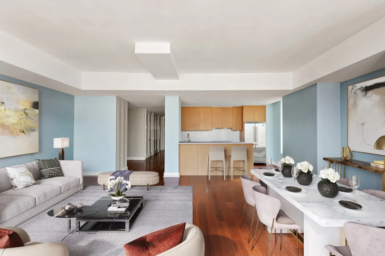 a living room with furniture and wooden floor