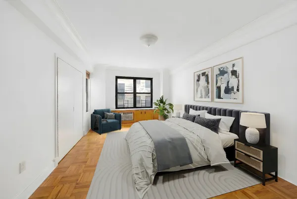 a bedroom with a large bed and a window