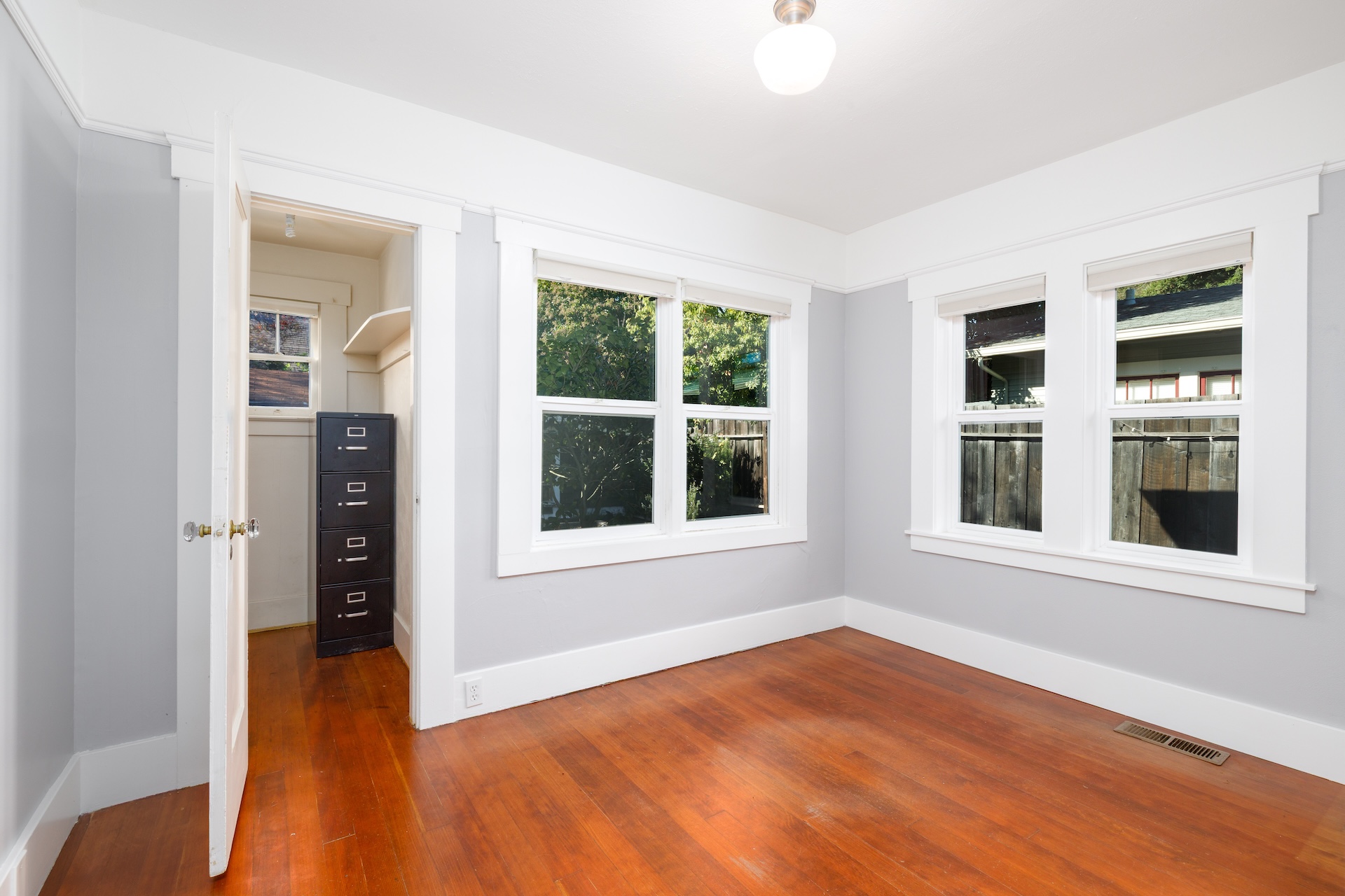 1203 Glenn Street Santa Rosa, CA 95401 - Photo 23 of 26 a view of an empty room with a window and wooden floor