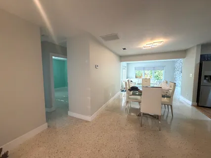 a dining room with furniture and a livingroom
