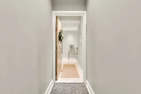 a view of a hallway with white walls