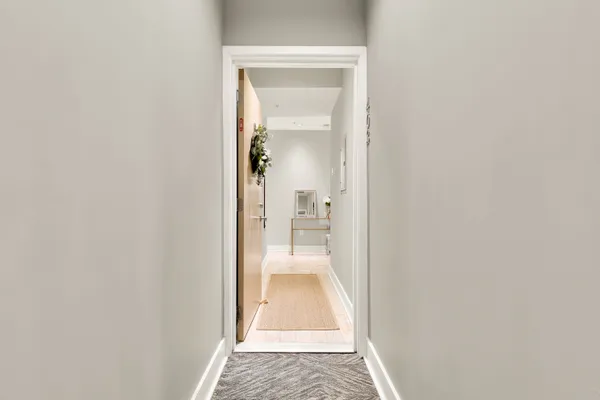 a view of a hallway with white walls