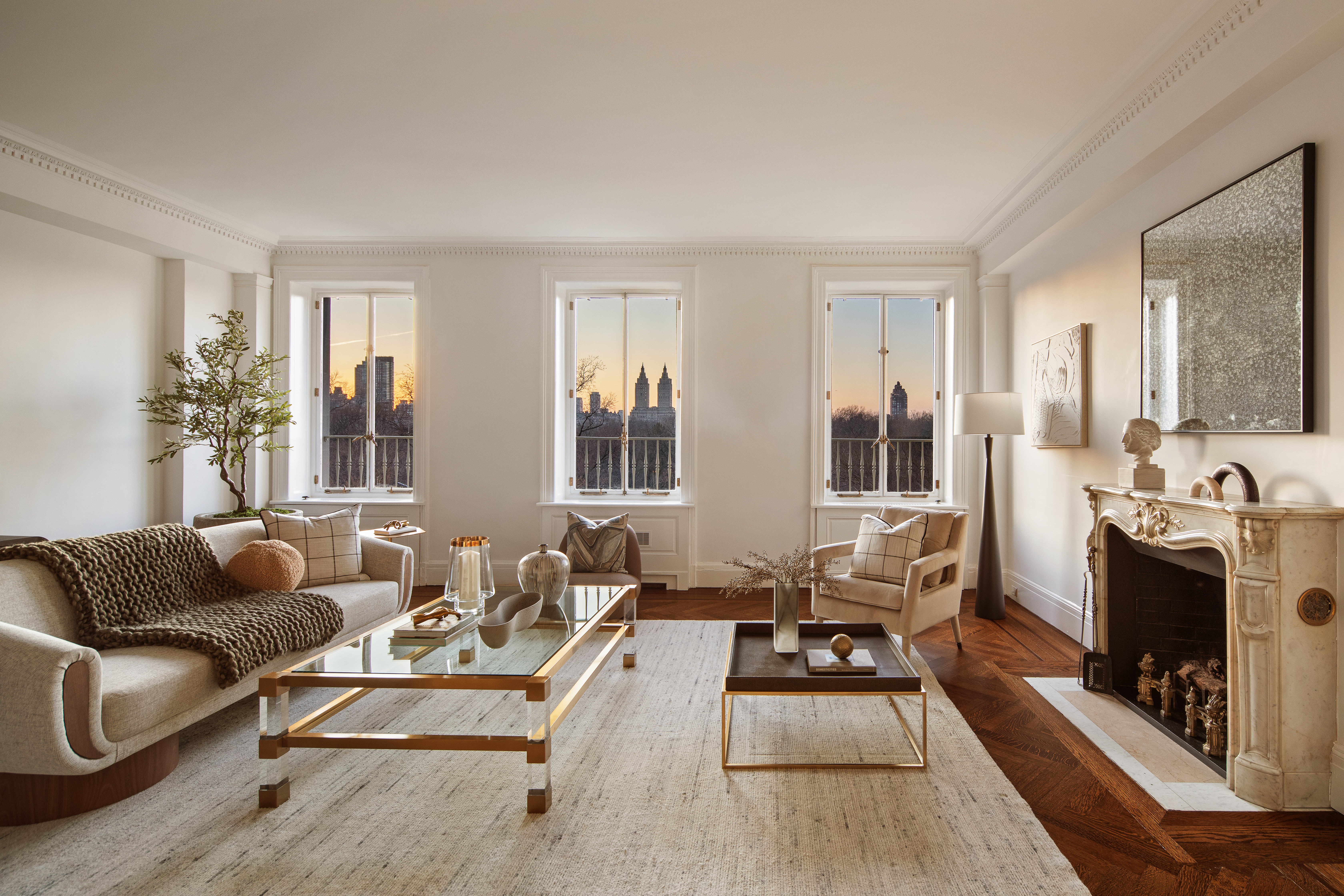 953 5th Avenue, Unit 7/8 Manhattan, NY 10075 - Photo 1 of 15 a living room with furniture a fireplace and large windows
