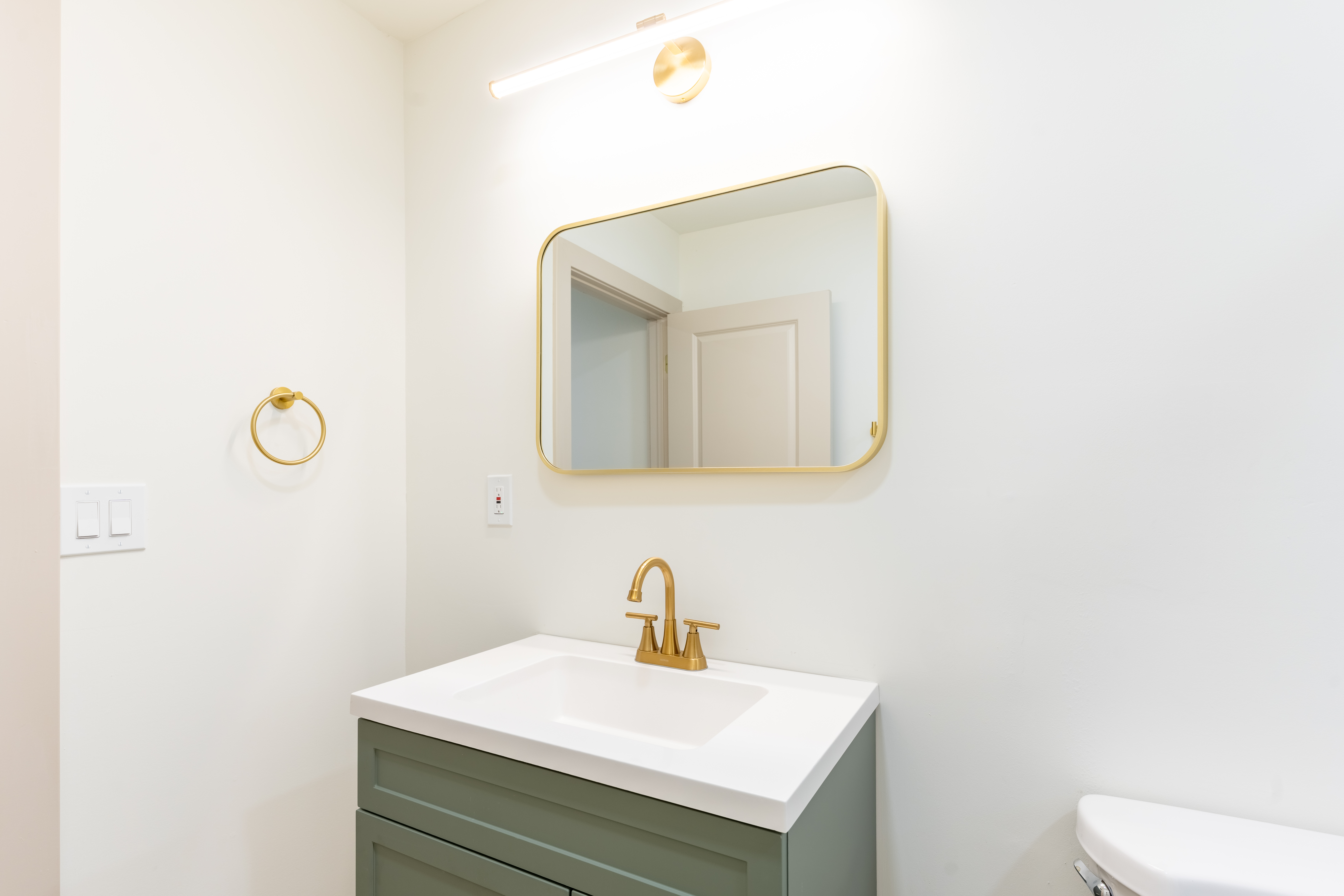 415 North Haddon Avenue Haddonfield, NJ 08033 - Photo 16 of 23 a bathroom with a toilet sink vanity and mirror