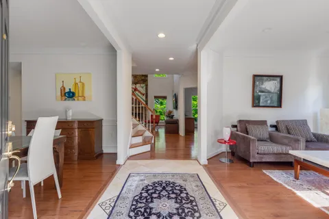 a living room with furniture and a rug