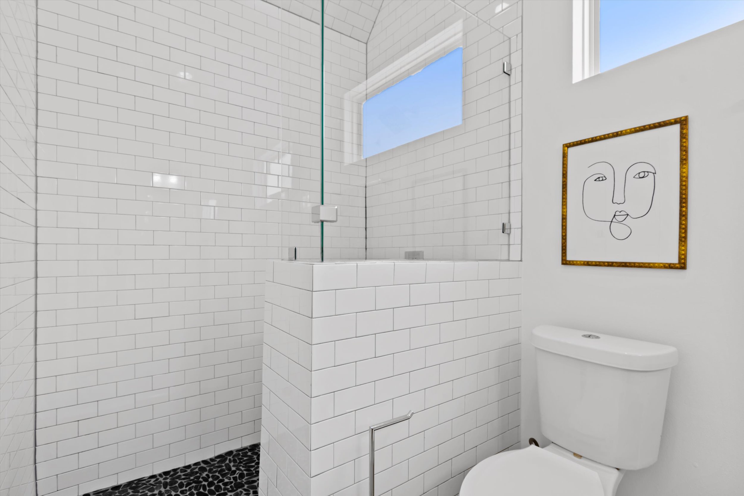 513 West Croslin Street, Unit A Austin, TX 78752 - Photo 19 of 39 a bathroom with a toilet and a shower