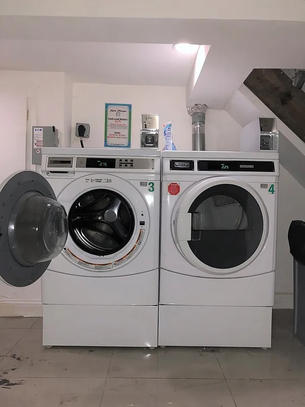 313 Van Buren Street Brooklyn, NY 11221 - Photo 19 of 20 a utility room with dryer and washer