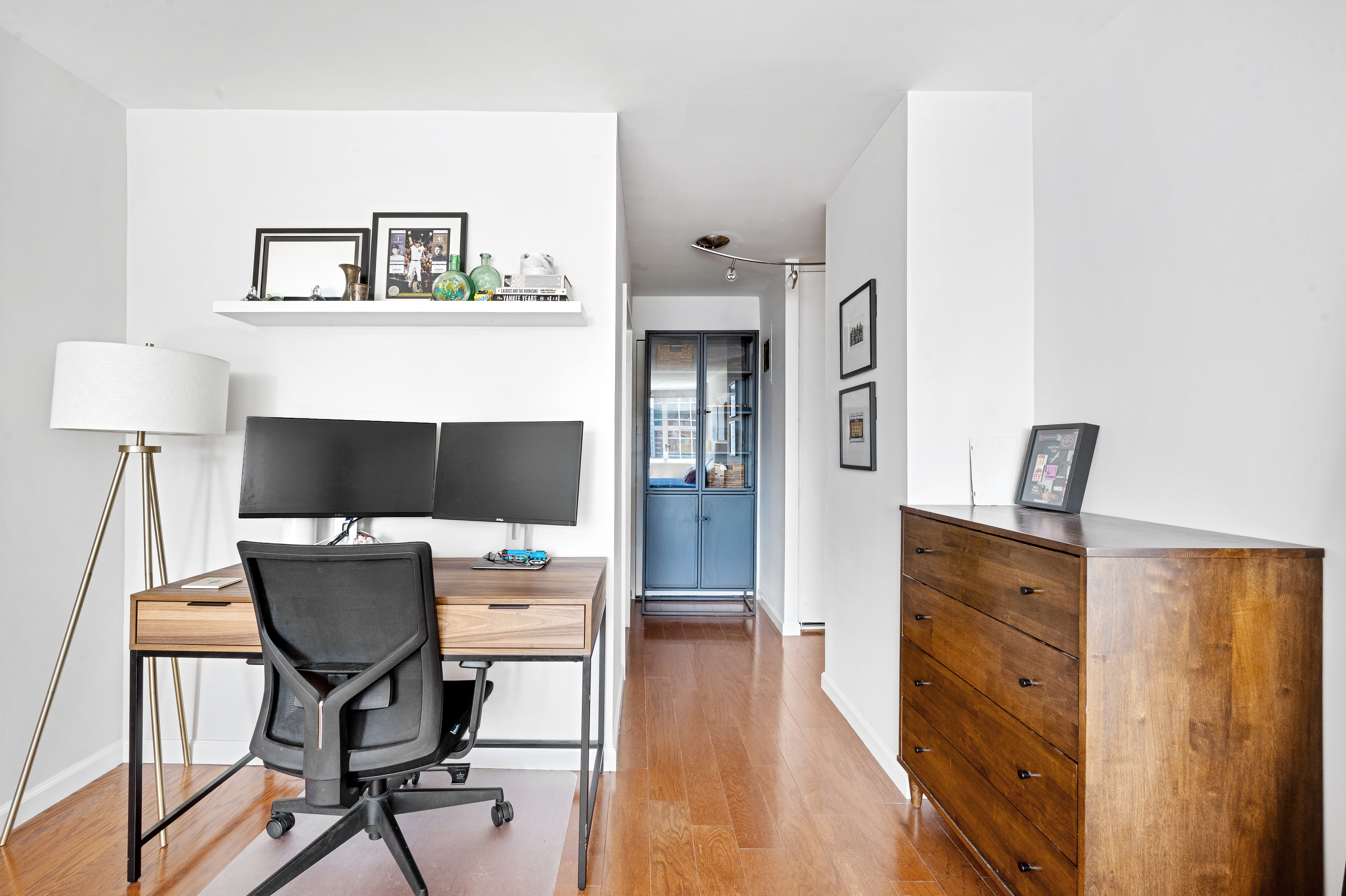245 East 54th Street, Unit 26JK Manhattan, NY 10022 - Photo 10 of 12 a living room with furniture and a flat screen tv