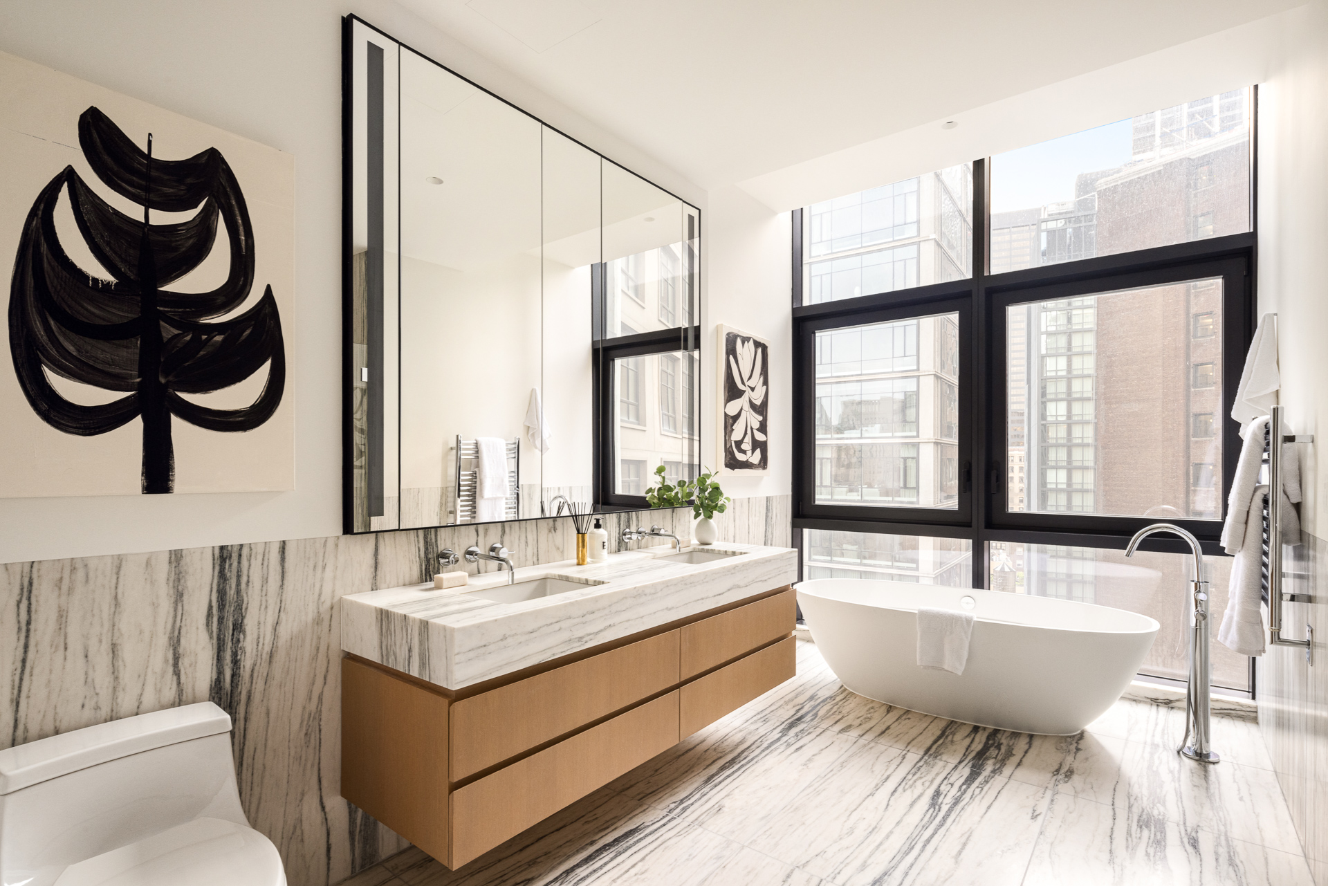 33 Park Row, Unit PH3 Manhattan, NY 10038 - Photo 16 of 30 a bathroom with a bathtub and a sink