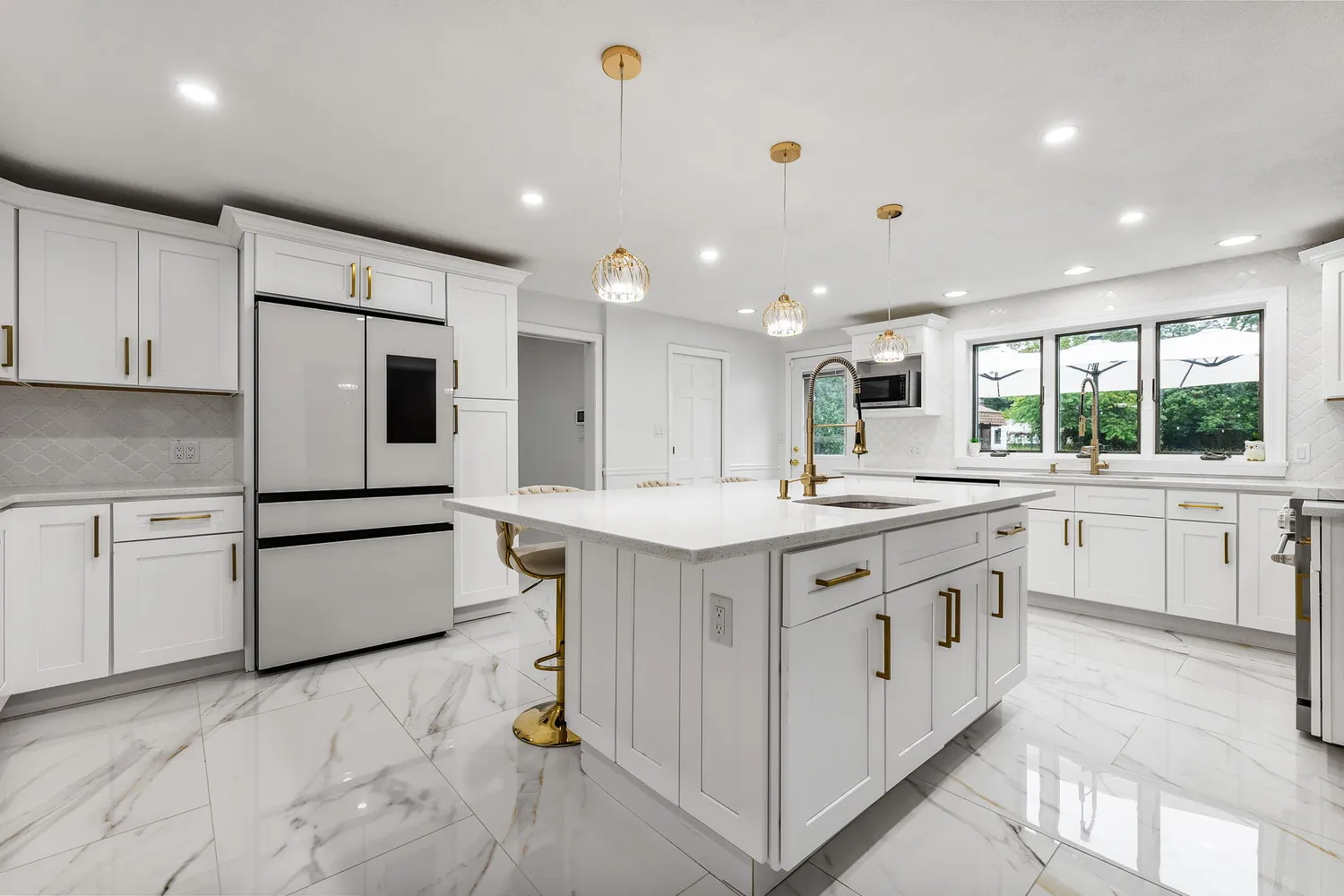 a kitchen with stainless steel appliances granite countertop a sink and cabinets