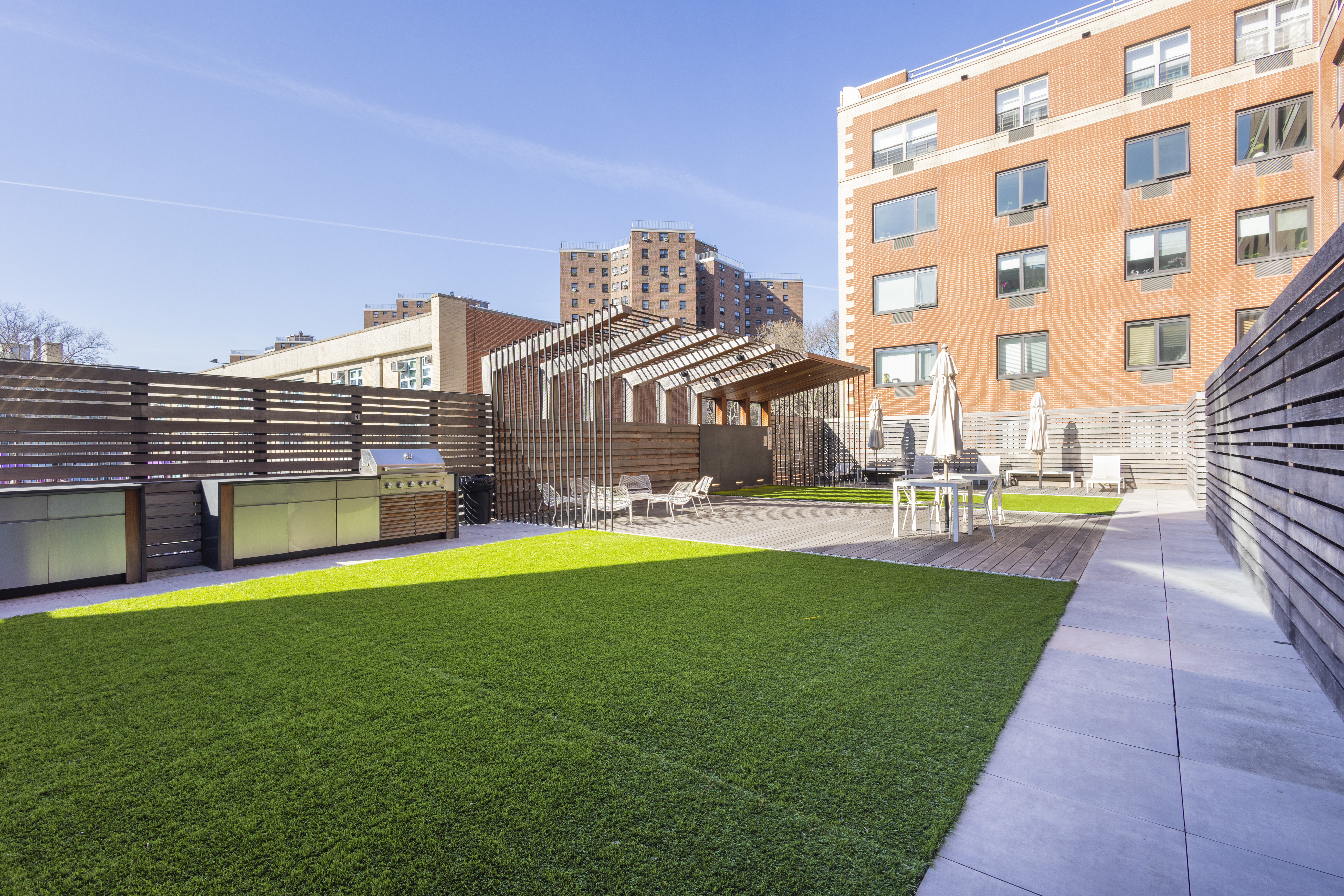 1330 5th Avenue, Unit 6C Manhattan, NY 10026 - Photo 13 of 16 a view of a building with a yard