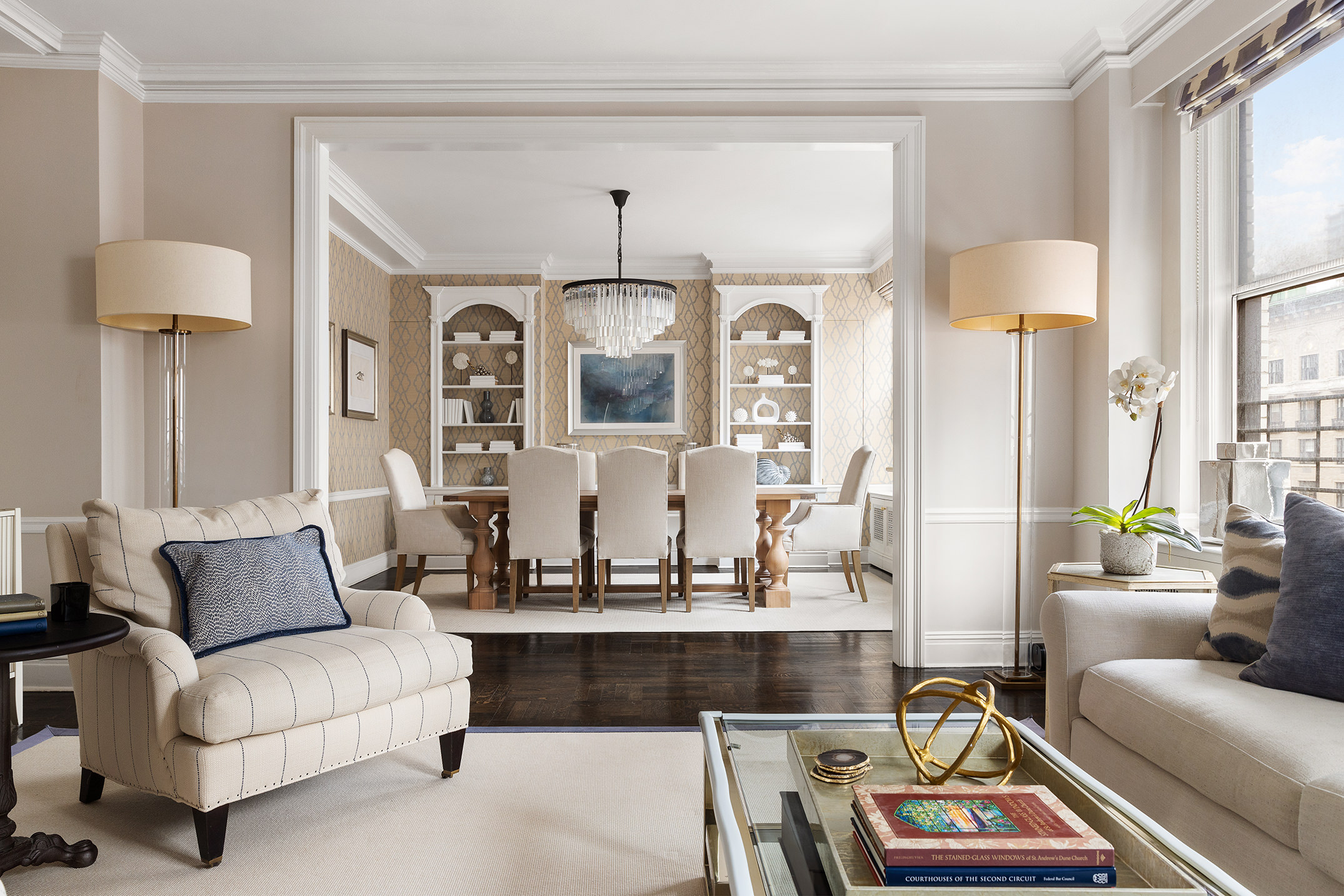 570 Park Avenue, Unit 10D Manhattan, NY 10065 - Photo 5 of 17 a living room with furniture a large window and a chandelier
