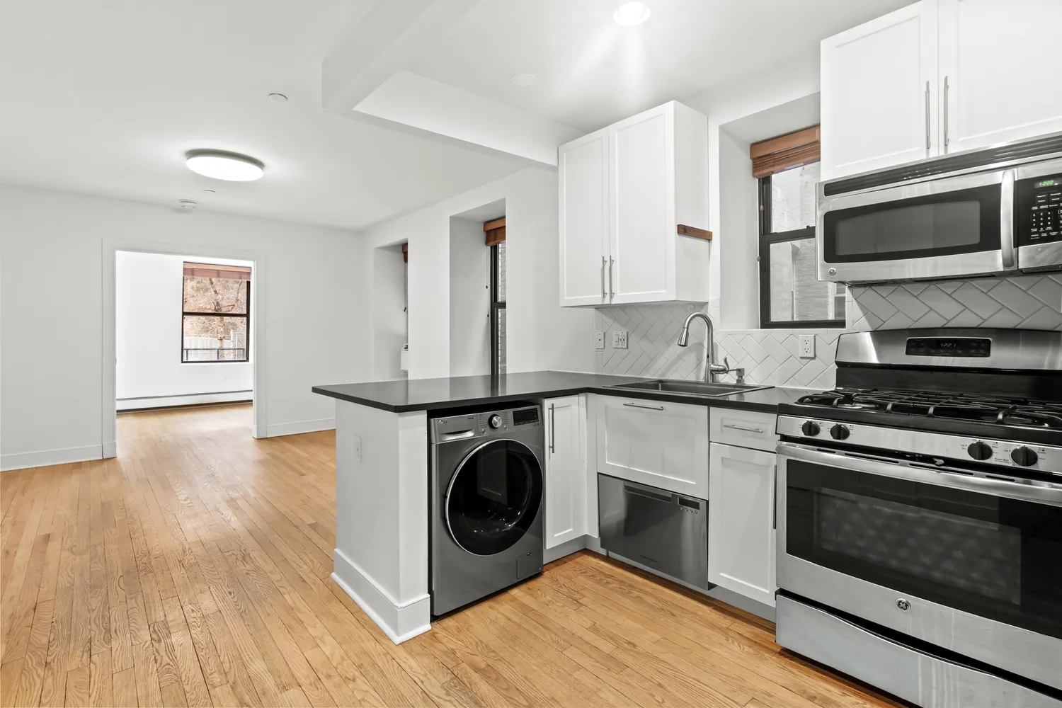 a kitchen with a stove and a microwave