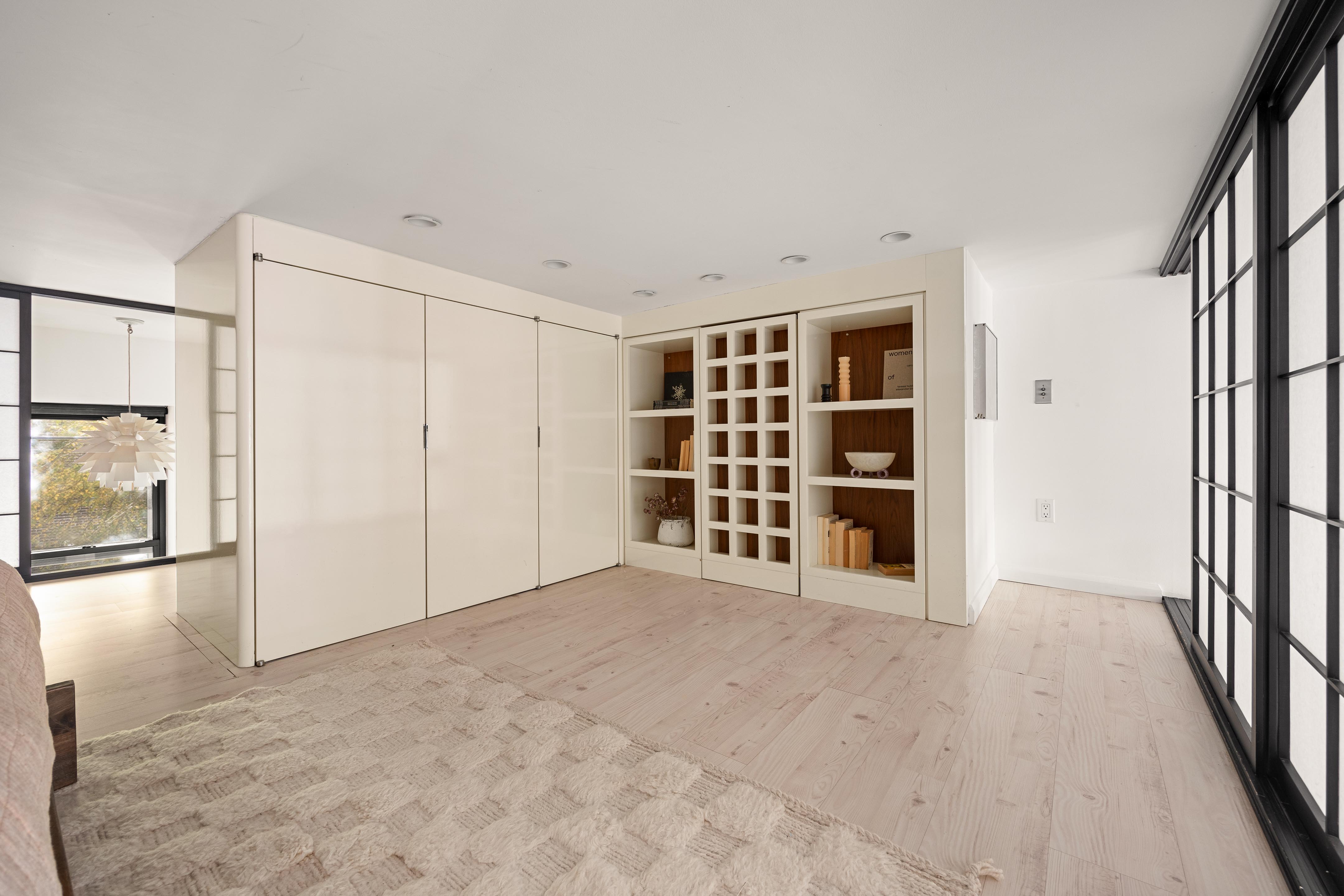 300 East 4th Street, Unit 2A Manhattan, NY 10009 - Photo 9 of 15 a view of an empty room with a window