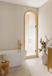 a bathroom with a tub and a sink