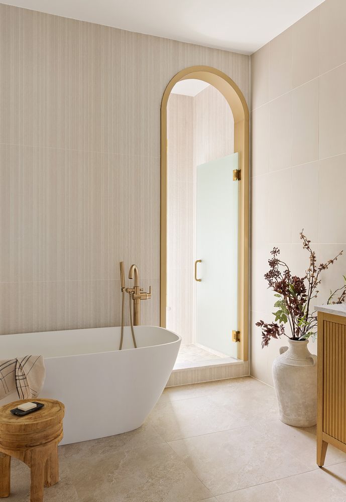 a bathroom with a tub and a sink