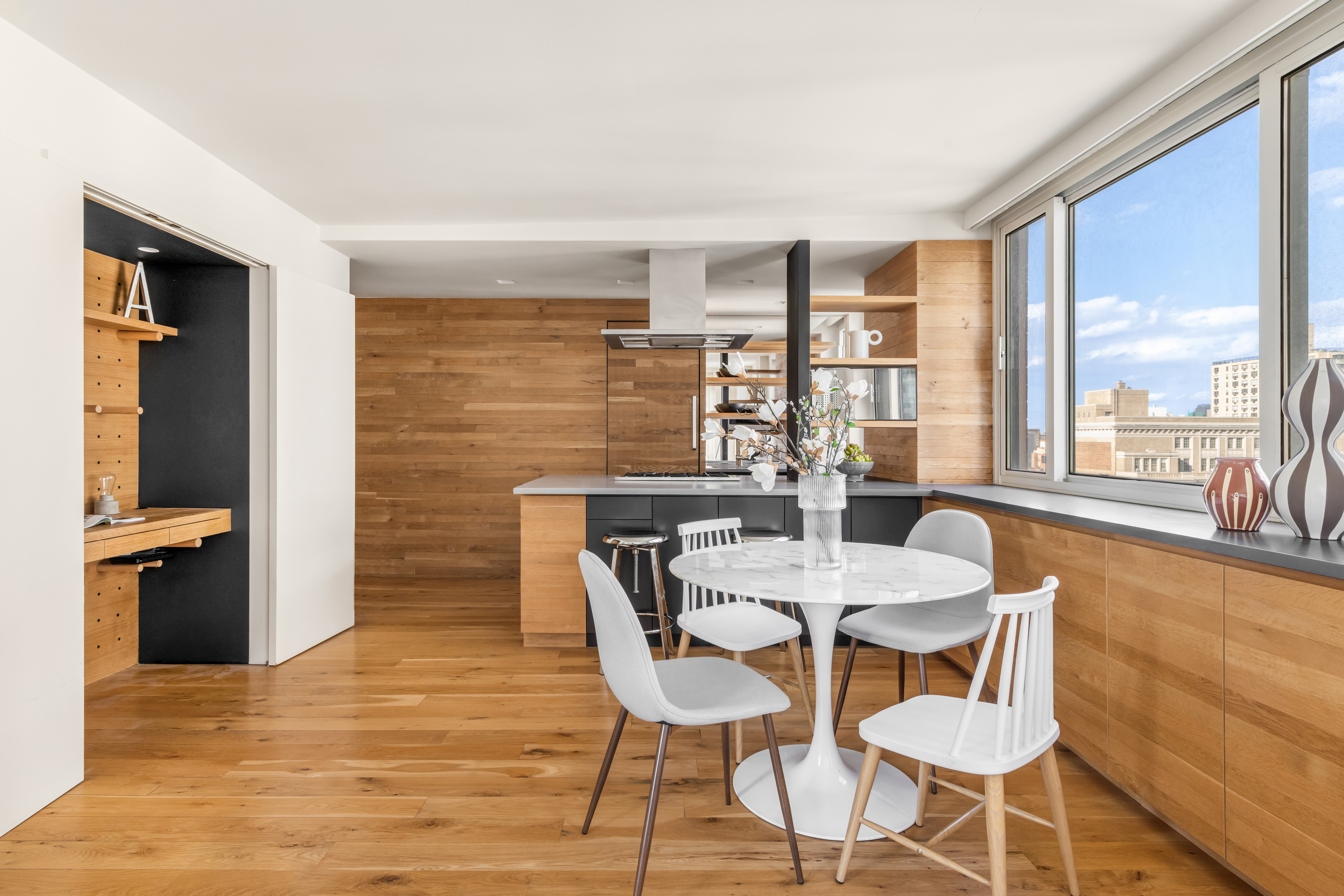 1 Irving Place, Unit G20A Manhattan, NY 10003 - Photo 3 of 14 a dining room with furniture and wooden floor