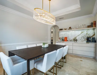 a view of a dining table and chairs in the kitchen