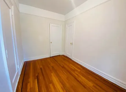 a view of small space with wooden floor