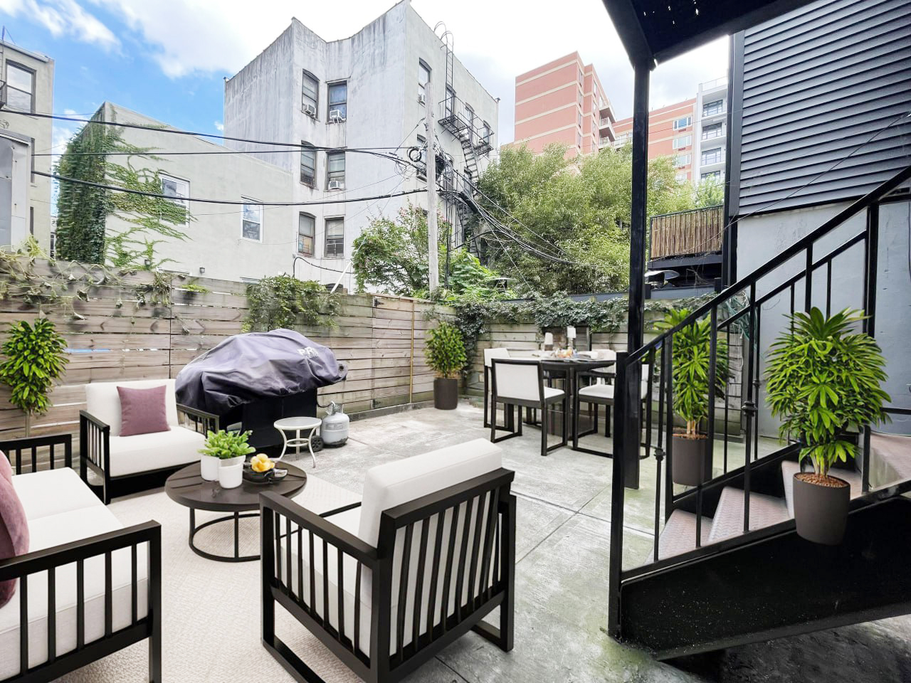 157 Prospect Avenue, Unit 1 Brooklyn, NY 11215 - Photo 9 of 10 a view of a patio with couches table and chairs and potted plants