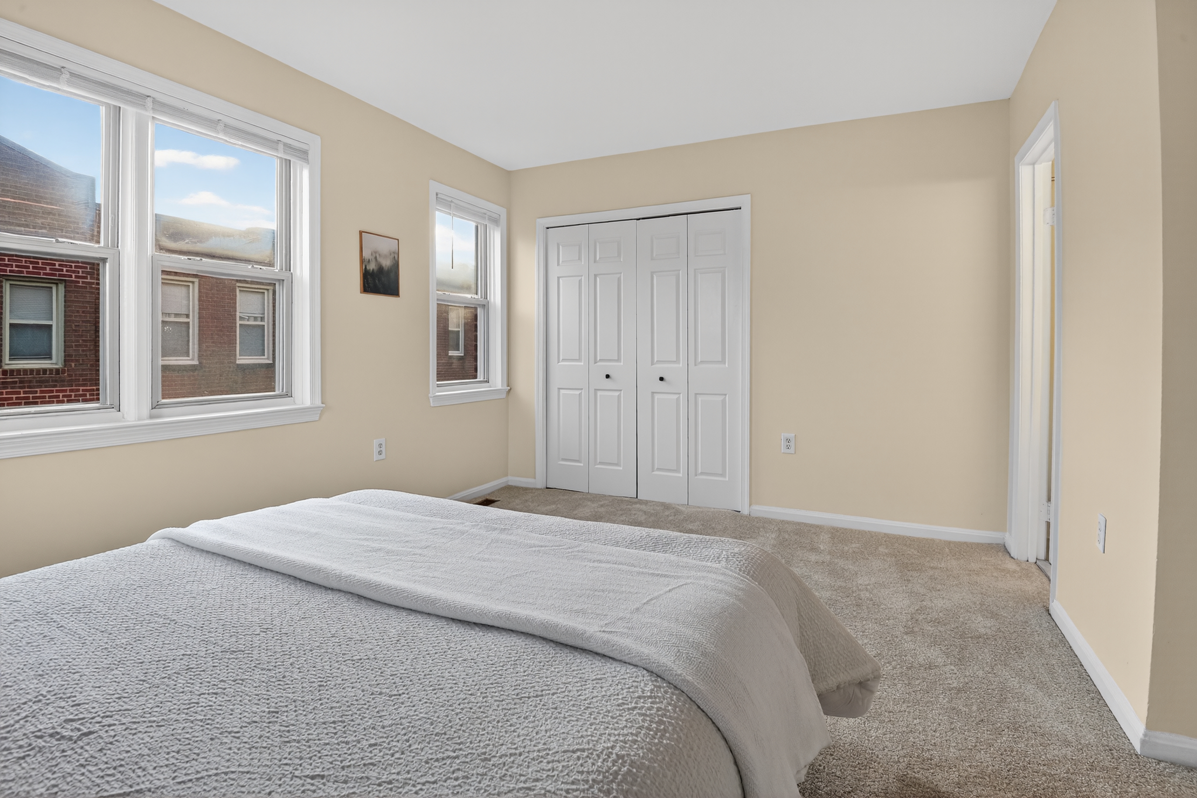 1493 15th Street Northeast, Unit 1493 Washington, DC 20002 - Photo 23 of 26 a bedroom with a bed and a window