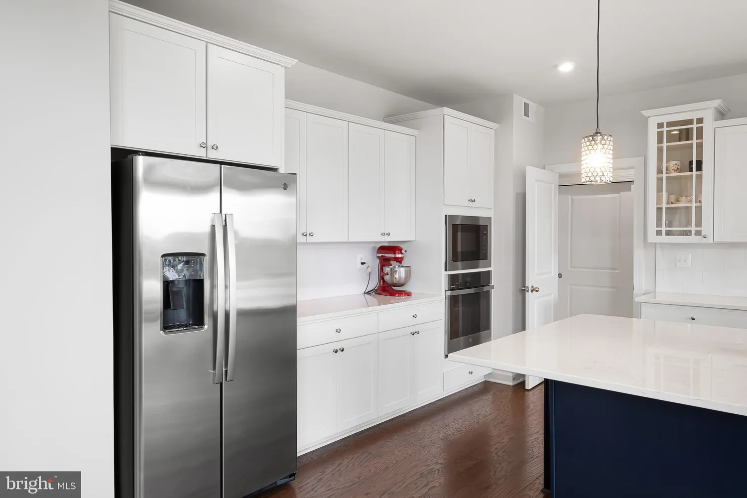a kitchen with stainless steel appliances a refrigerator sink and cabinets