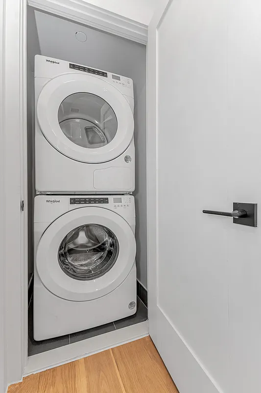 21-10 30th Avenue, Unit 1R Queens, NY 11102 - Photo 11 of 16 a utility room with dryer and washer