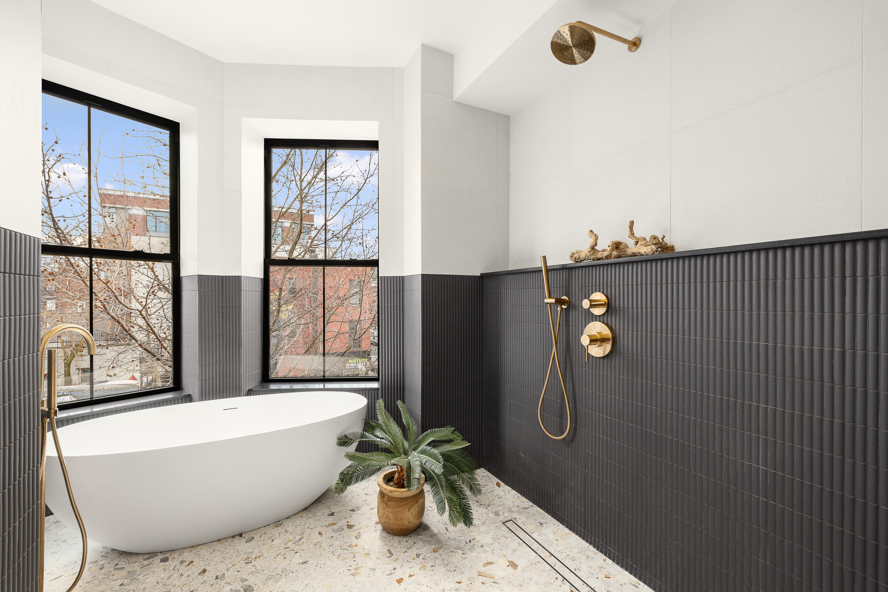 167 Quincy Street Brooklyn, NY 11216 - Photo 12 of 20 a bath tub sitting next to a window