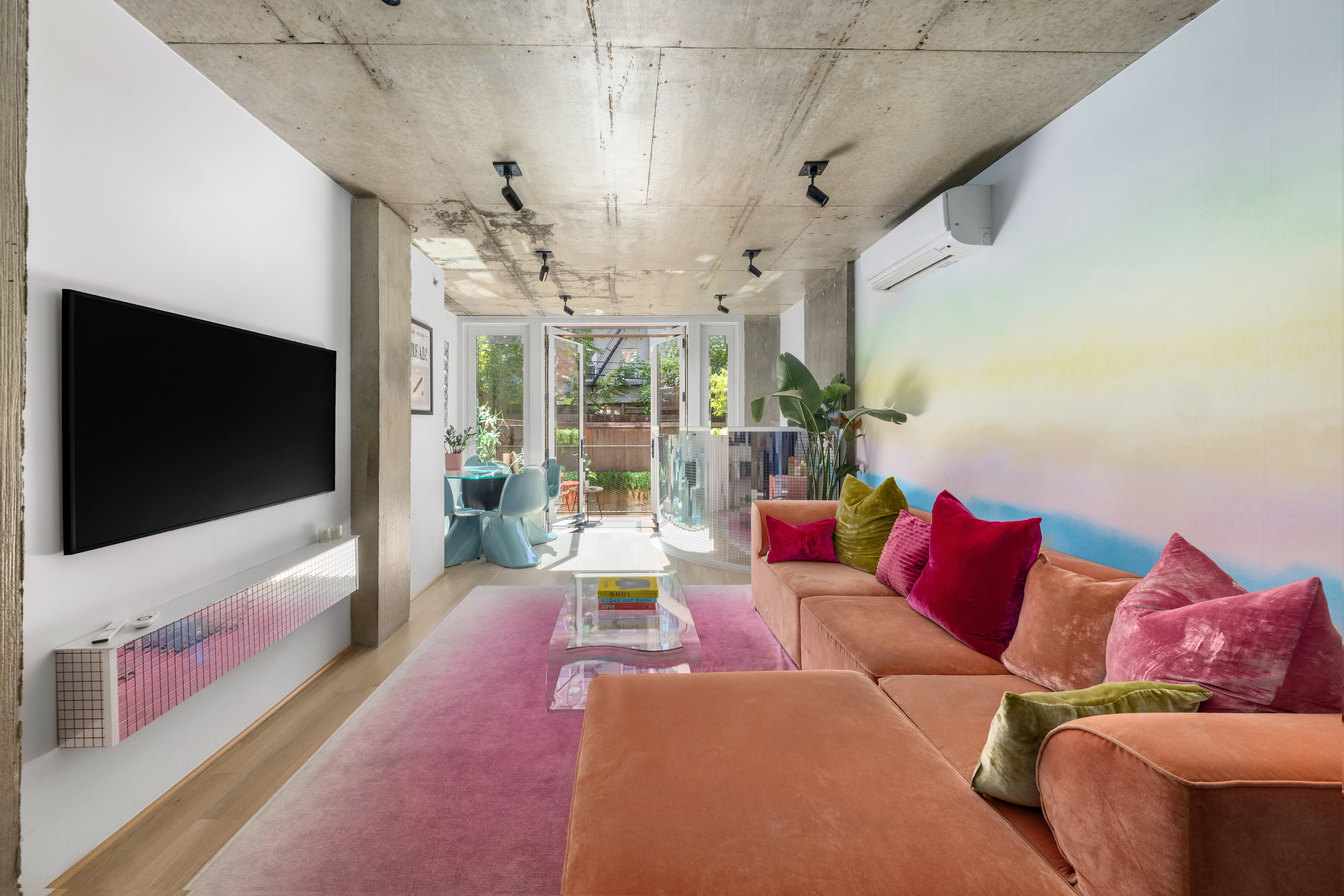 126 South 2nd Street, Unit GARDEN Brooklyn, NY 11249 - Photo 6 of 30 a living room with furniture and a flat screen tv