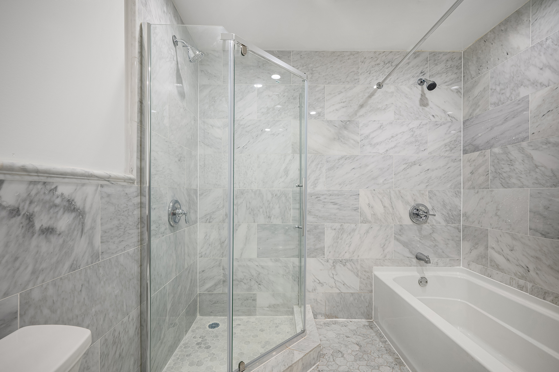 307 West 136th Street Manhattan, NY 10030 - Photo 10 of 26 a bathroom with a bathtub shower sink and toilet