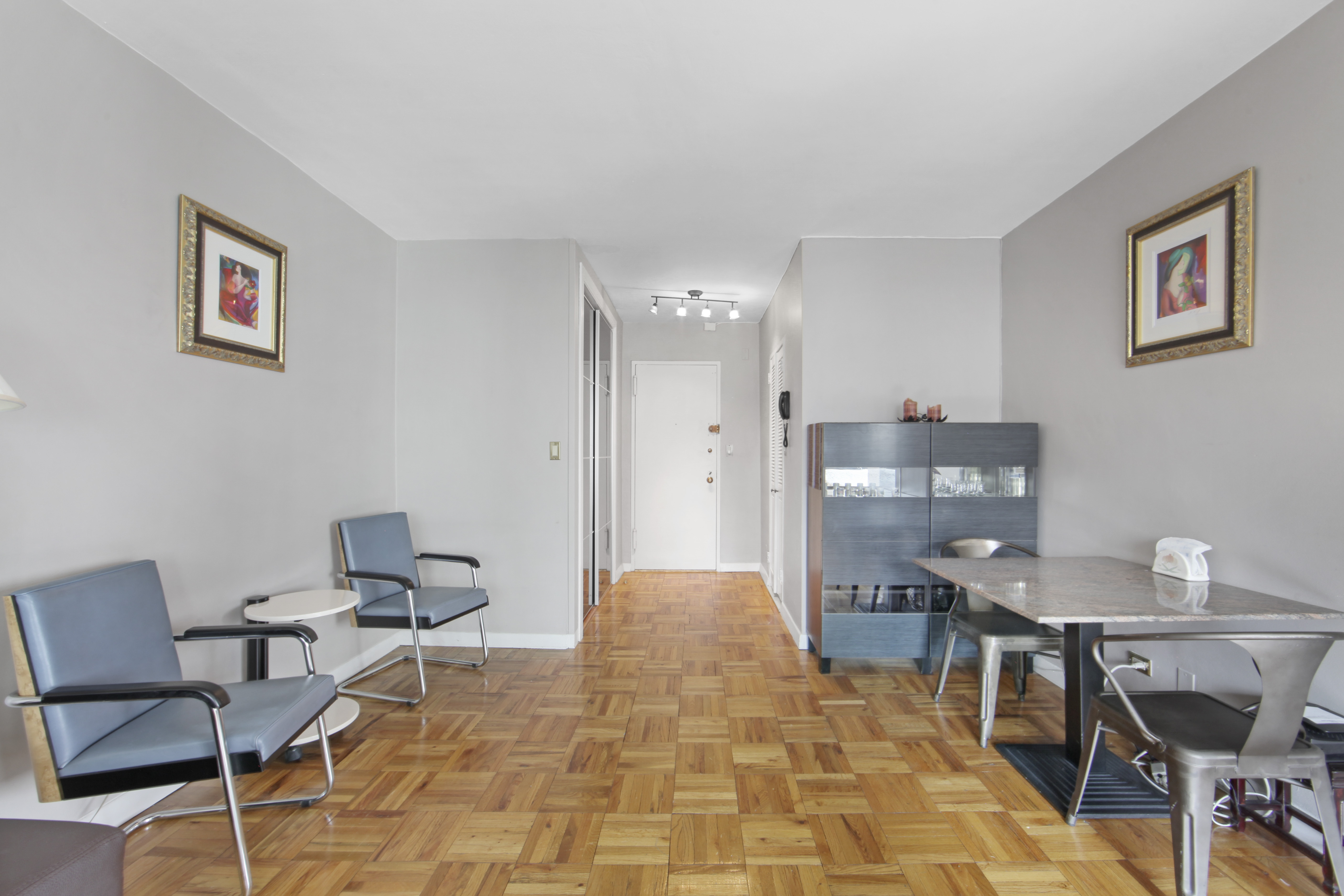 160 East 65th Street, Unit 8A Manhattan, NY 10065 - Photo 8 of 13 a workspace with furniture and window