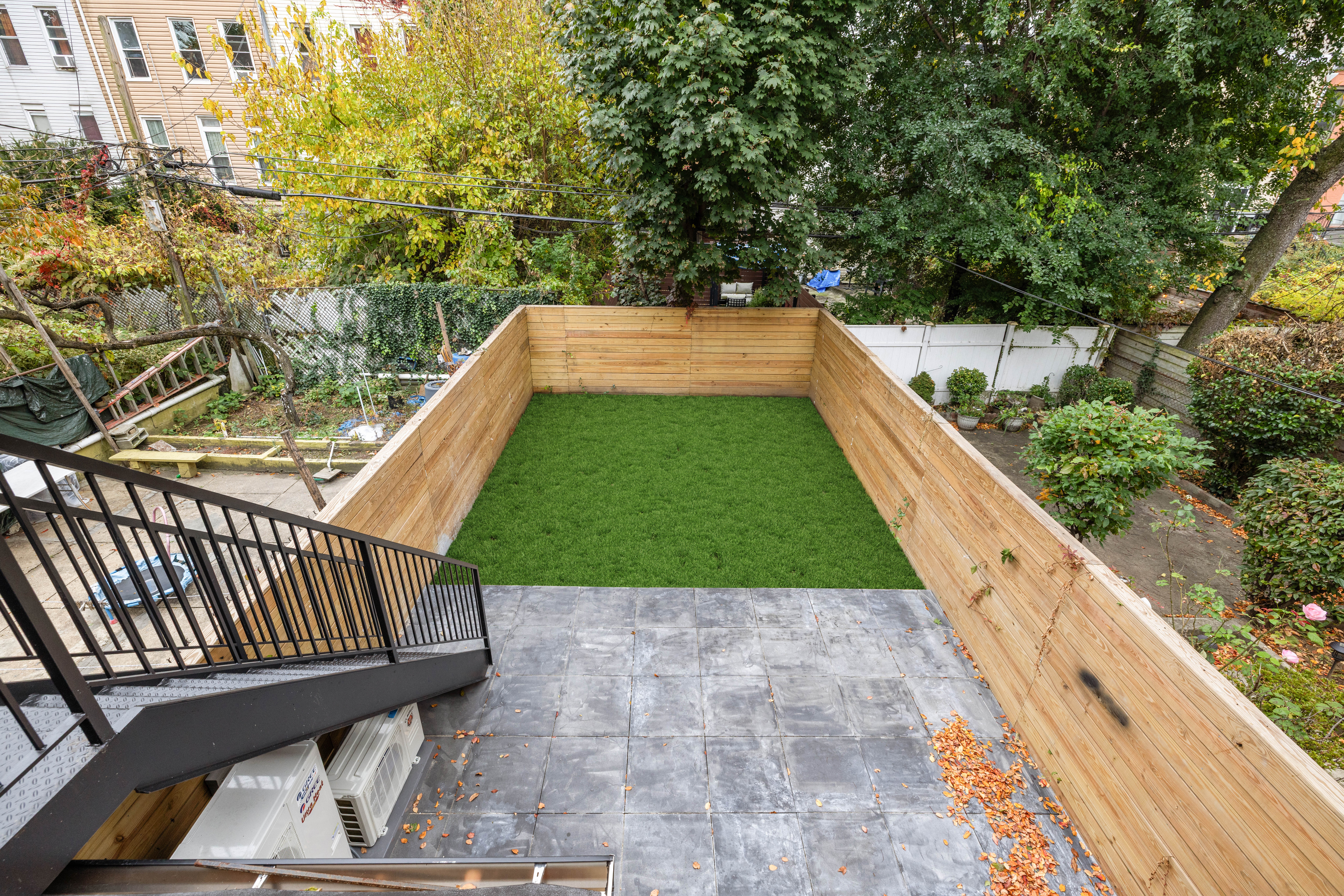 668 Decatur Street Brooklyn, NY 11233 - Photo 11 of 14 a view of a backyard with sitting area