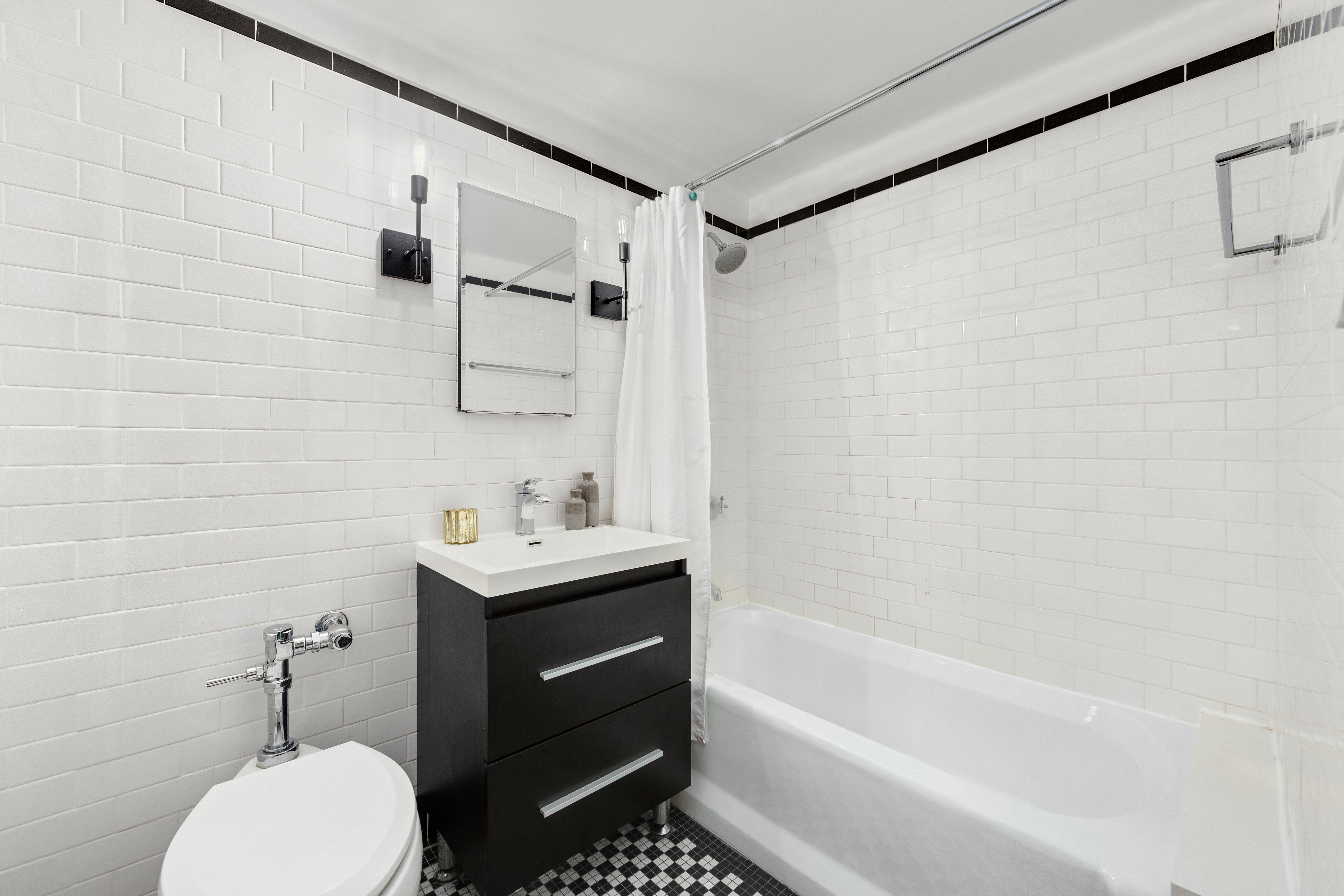 470 West 24th Street, Unit 2C Manhattan, NY 10011 - Photo 11 of 15 a bathroom with a sink toilet and shower