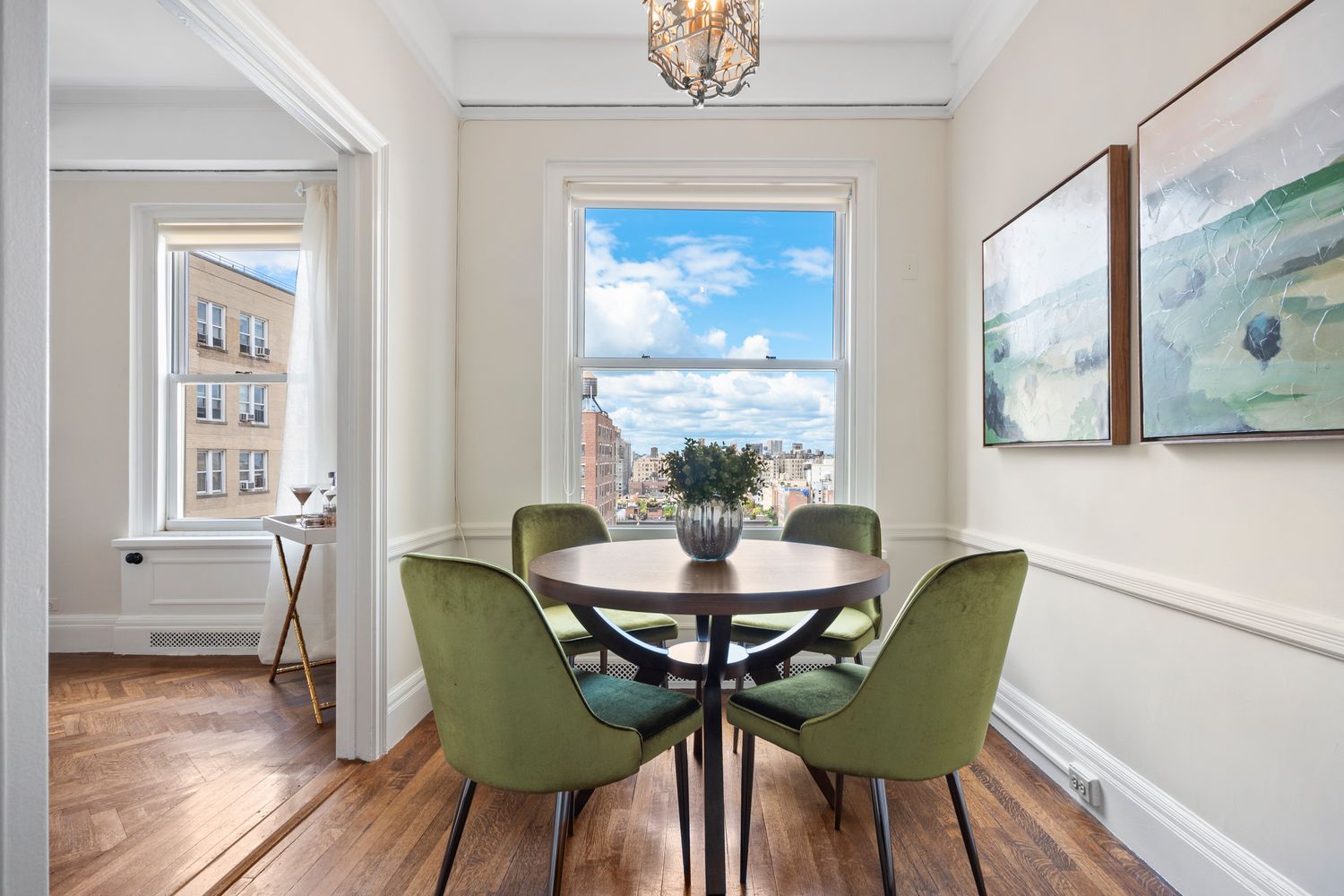 a view of a dining room with furniture and wooden floor