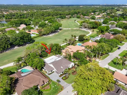 an aerial view of a houses with a lake view