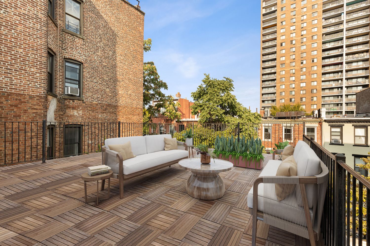315 Washington Avenue Brooklyn, NY 11205 - Photo 25 of 38 a view of a patio with couches chairs potted plants and wooden floor